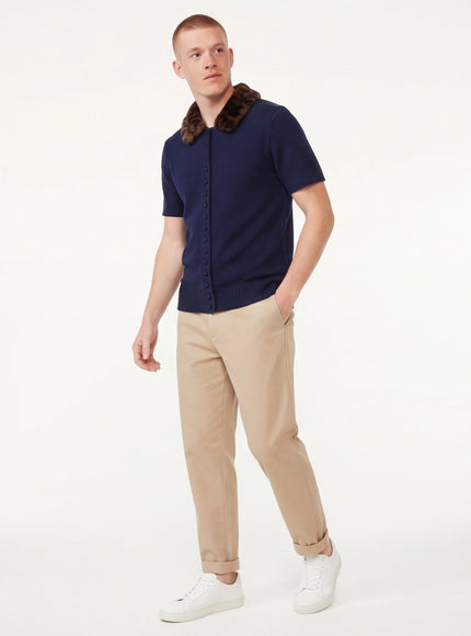 Close-up of Navy Blue animal print collar knitted jacket fabric