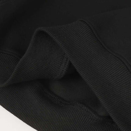 Close-up of the fabric and cuff detail of the Patchwork Embroidered Hoodie – Loose Fit, showcasing quality and comfort.
