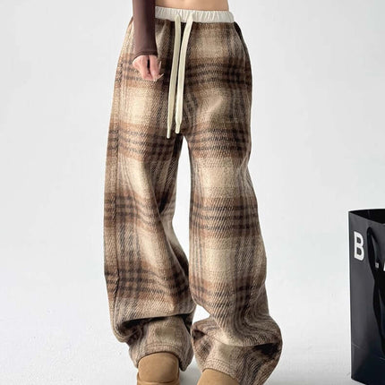Plaid Flannel Fleece Lined Winter Pants featuring a checkered pattern and relaxed fit for warmth and style.