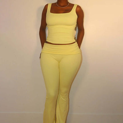 Woman wearing a Pleated Vest Two-Piece Set – Loose Fit in yellow, showcasing a modern casual style.