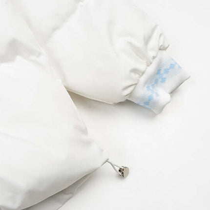 Detail of the Plush Hooded Cotton Coat showcasing its cozy white fabric and stylish sleeve design.