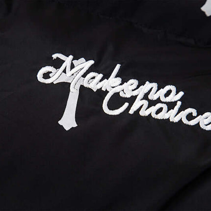 Close-up of embroidered logo on the Print Stand Collar Cotton Puffer Jacket for Women, showcasing modern street style.