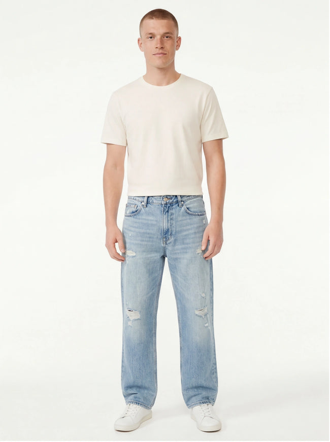 Model wearing Light Blue denim jeans, distressed pants by Grozavu