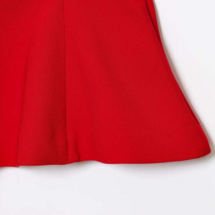 Close-up view of the hem of the red Grozavu Strapless Camisole Tank Top – Slim Fit, showcasing its elegant skirt style.