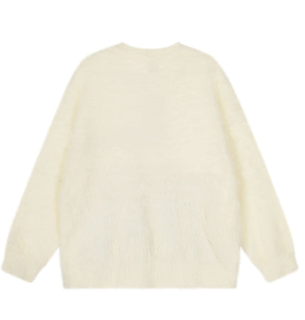 Back view of Regular Fit Animal Print Fleece Sweater in soft ice cream color, featuring cozy fleece texture.