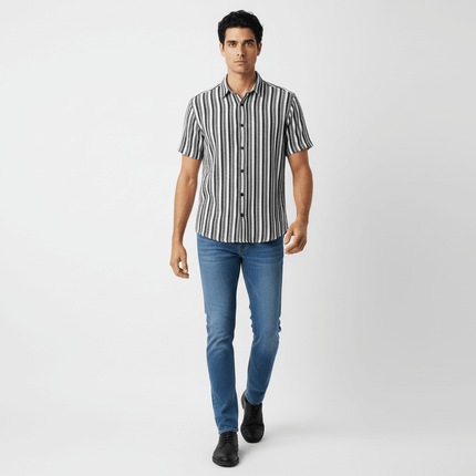 Retro Stripe Short Sleeve Shirt – Loose Fit worn by a man with blue jeans, showcasing vintage-inspired street style.