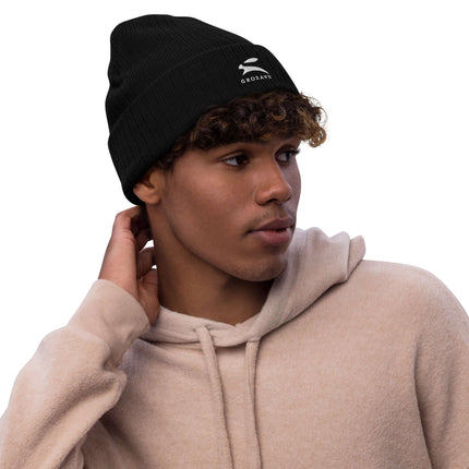 Stylish ribbed knit beanie worn by a young man, perfect for warmth and fashion.
