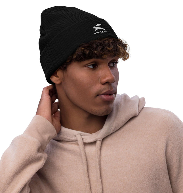 Stylish ribbed knit beanie worn by a young man, perfect for warmth and fashion.