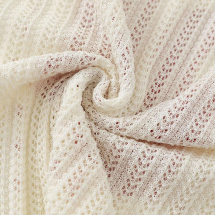 Close-up view of the fabric texture featuring the design of the Round Neck Jacquard Knit Sweater.