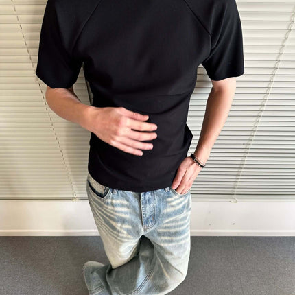 Seamless Jacquard TShirt – Loose Fit worn by a man, showcasing a stylish black design with relaxed fit.