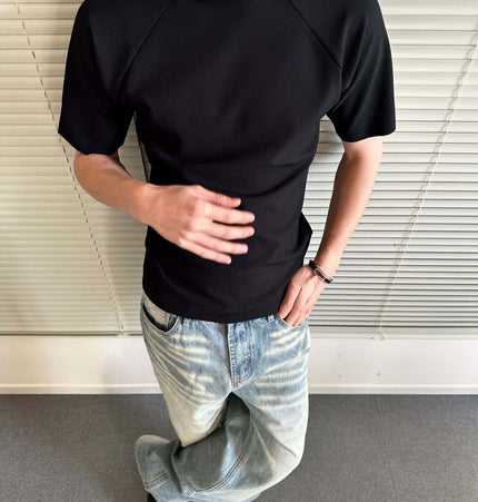 Seamless Jacquard TShirt – Loose Fit worn by a man, showcasing a stylish black design with relaxed fit.