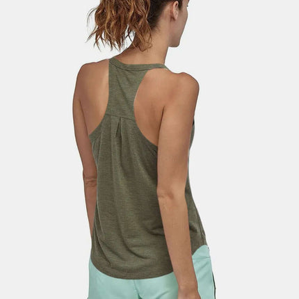 Back view of a woman wearing a Slim Fit Cotton Scoop Neck Tank Top with shorts.