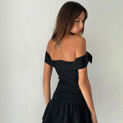 Slim Fit One-Shoulder Bow Top shown from the back, featuring a stylish bow accent and flattering silhouette.