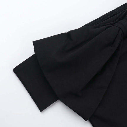 Close-up of the Slim Fit One-Shoulder Bow Top showing the bow detail and neckline design.