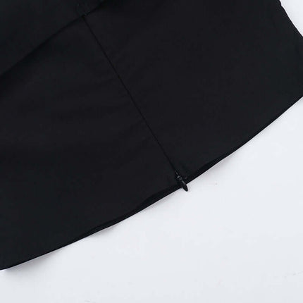 Close-up view of the Slim Fit One-Shoulder Bow Top showing the stylish bow detail and zip closure.