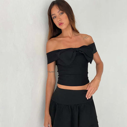Slim Fit One-Shoulder Bow Top worn by model, featuring a bow accent and stylish one-shoulder design.