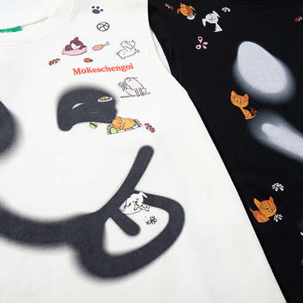 Smiley Graffiti Print Sleeveless Tank Top showcasing playful cat graphics on light and dark fabrics.