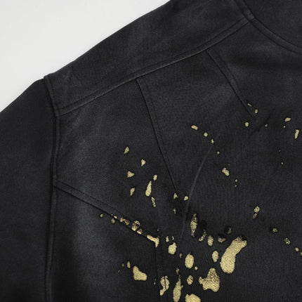 Splashing Ink Spliced Hooded Sweatshirt featuring a bold black design with gold splashes for artistic streetwear.