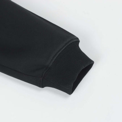 Close-up of the sleeve of the Splashing Ink Spliced Hooded Sweatshirt showcasing the ribbed cuff detail.