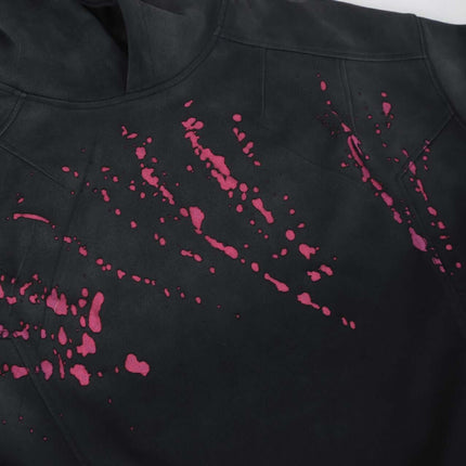 Splashing Ink Spliced Hooded Sweatshirt showing vibrant ink splash design on black fabric.