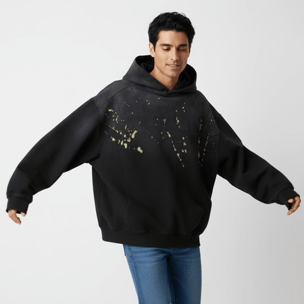 Splashing Ink Spliced Hooded Sweatshirt featuring a unique black and yellow splashing ink design, ideal for casual streetwear.