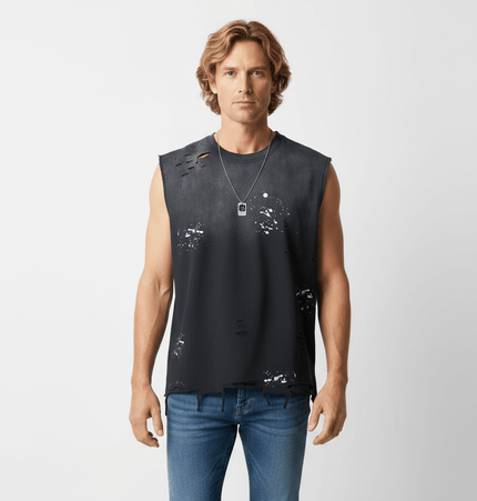 Model wearing a Splatter Ink Tank Top – Loose Fit showcasing a distressed, artistic design in a streetwear style.