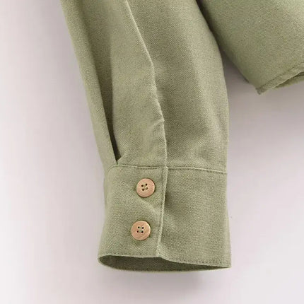 Spliced Green Shirt – Loose Fit close-up showing button detail and soft texture on the sleeve.