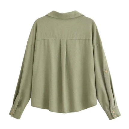 Back view of the Spliced Green Shirt – Loose Fit, showcasing its stylish design and comfortable fit.