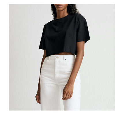 Sport Crop Cotton Top - Loose Fit in black, featuring a cropped silhouette and casual style with white jeans.