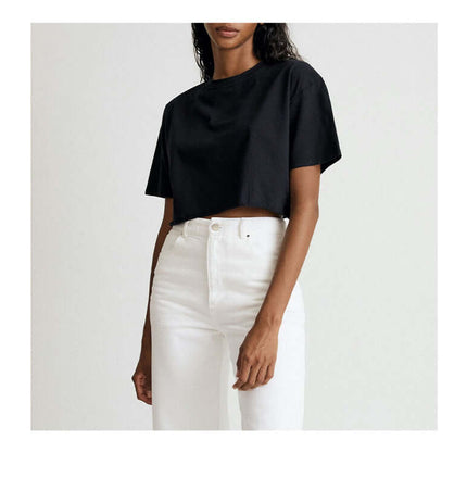 Sport Crop Cotton Top - Loose Fit in black, featuring a cropped silhouette and casual style with white jeans.