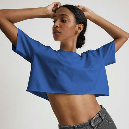 Sport Crop Cotton Top - Loose Fit displaying a model in a cropped blue top with short sleeves.