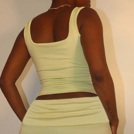 Back view of a woman wearing a Square Collar Pleated Two-Piece Set in soft green.