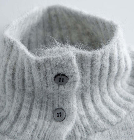 Stand Collar Pullover Sweater - Loose Fit close-up view of the ribbed high-neck collar with button details.