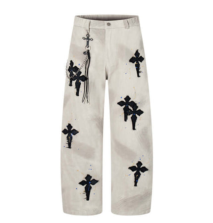 Straight Leg Patchwork Denim Jeans with cross patch embroidery and hand-painted color splatter detailing.