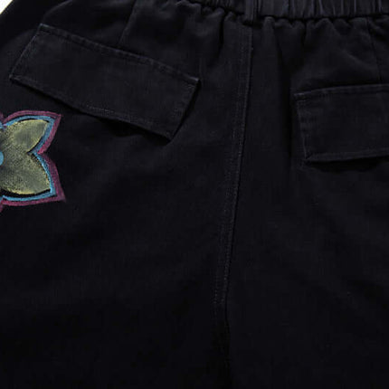 Pantalons en denim cargo imprimés graffiti