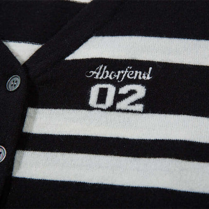Striped VNeck Knit Cardigan – Slim Fit featuring a black and white striped design and embroidered details.