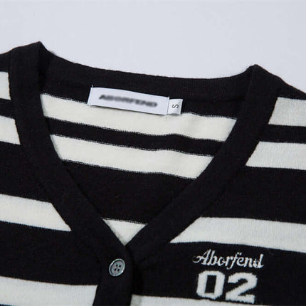 Striped VNeck Knit Cardigan – Slim Fit featuring classic black and white stripes and V-neckline.