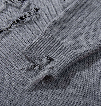 Tassel Distressed Knit Sweater – Loose Fit close-up showing distressed texture and tassel details.