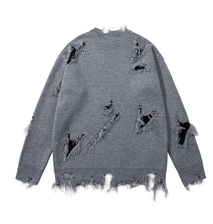 Back view of the Tassel Distressed Knit Sweater – Loose Fit showcasing its rugged, distressed design.