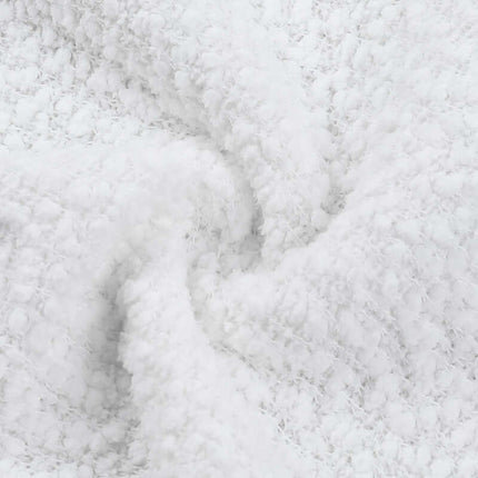 Close-up of textured fabric showcasing the soft, white texture from the Textured Vest Pants Suit – Casual Fit.