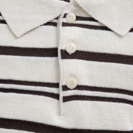 Turn-Down Collar Stripe Sweater featuring bold stripes and letter embroidery detail.