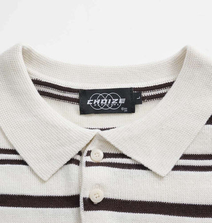 Turn-Down Collar Stripe Sweater with soft knit fabric and bold stripe detailing.