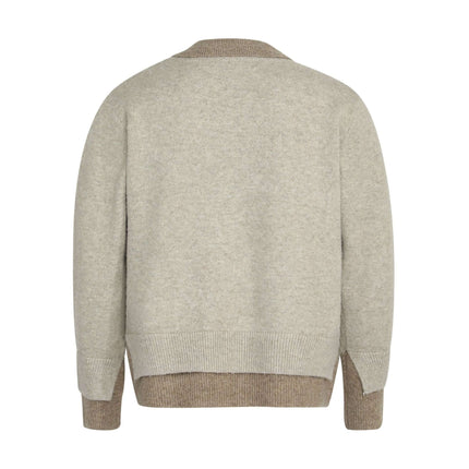Back view of the Two-Piece Style Knit Sweater – Loose Fit in a light beige color.