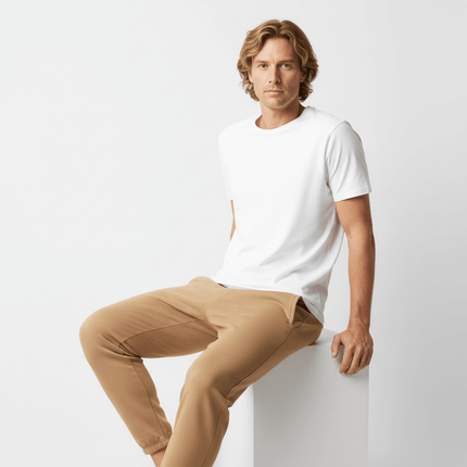 Urban Heavyweight Fleece Sweatpants styled with a white t-shirt, featuring a relaxed fit and smooth finish.