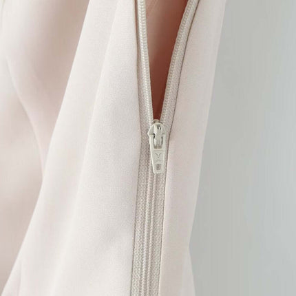 Close-up view of the zipper detail on the VNeck Sleeveless Crop Top - Slim Fit, showcasing sleek design and quality craftsmanship.