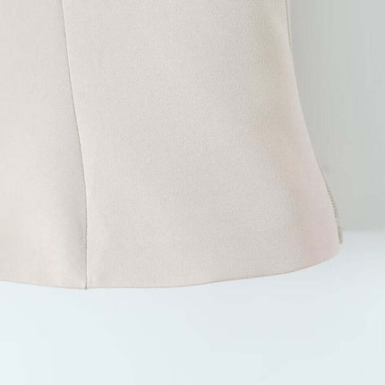 VNeck Sleeveless Crop Top - Slim Fit detail showing the smooth fabric and tailored cut in a light beige color.