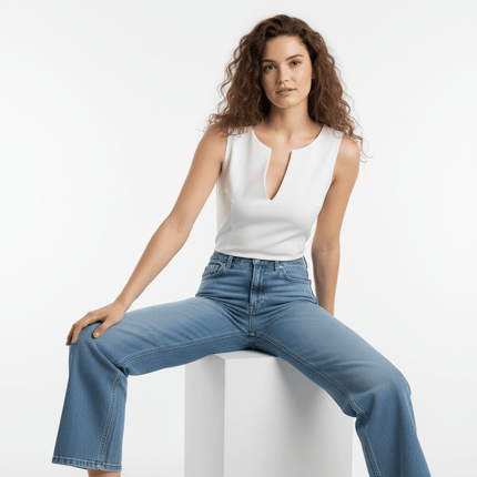 VNeck Sleeveless Crop Top - Slim Fit worn by a model, paired with high-waisted jeans for a trendy casual look.