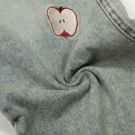 Close-up of Grozavu Patchwork Washed Straight Cropped Jeans with apple embroidery details.