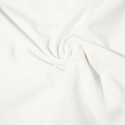 Close-up view of soft, white cotton fabric used in the Letter Cross Print Tank Top - Loose Fit for breathable summer comfort.