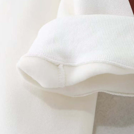 Detail of the sleeve cuff on the Grozavu Embroidered Pattern Hoodie – Loose Fit, showcasing soft fabric and design.